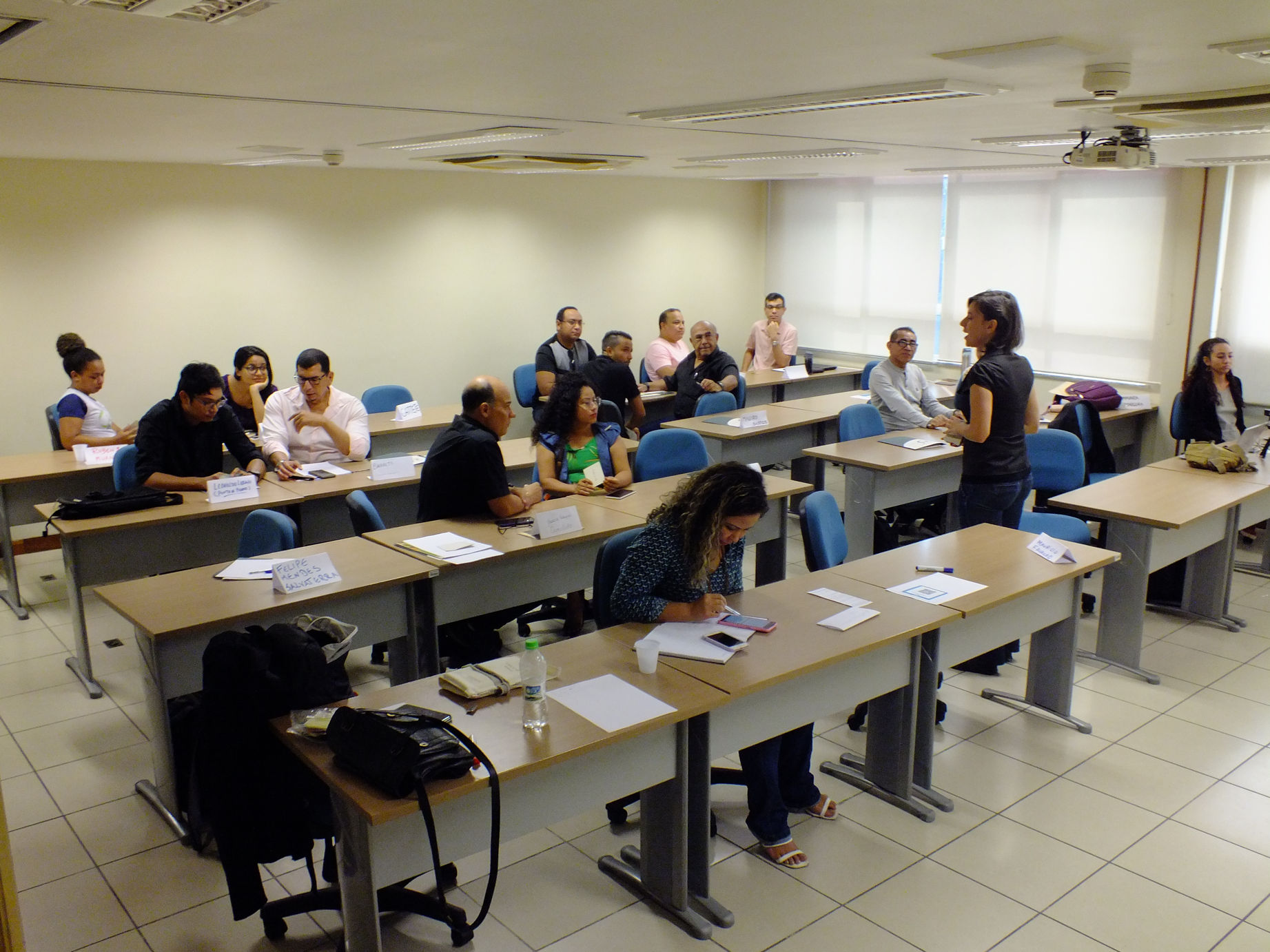 A group of managers during the dynamics facilitated by Georgia Cunha during the training course.